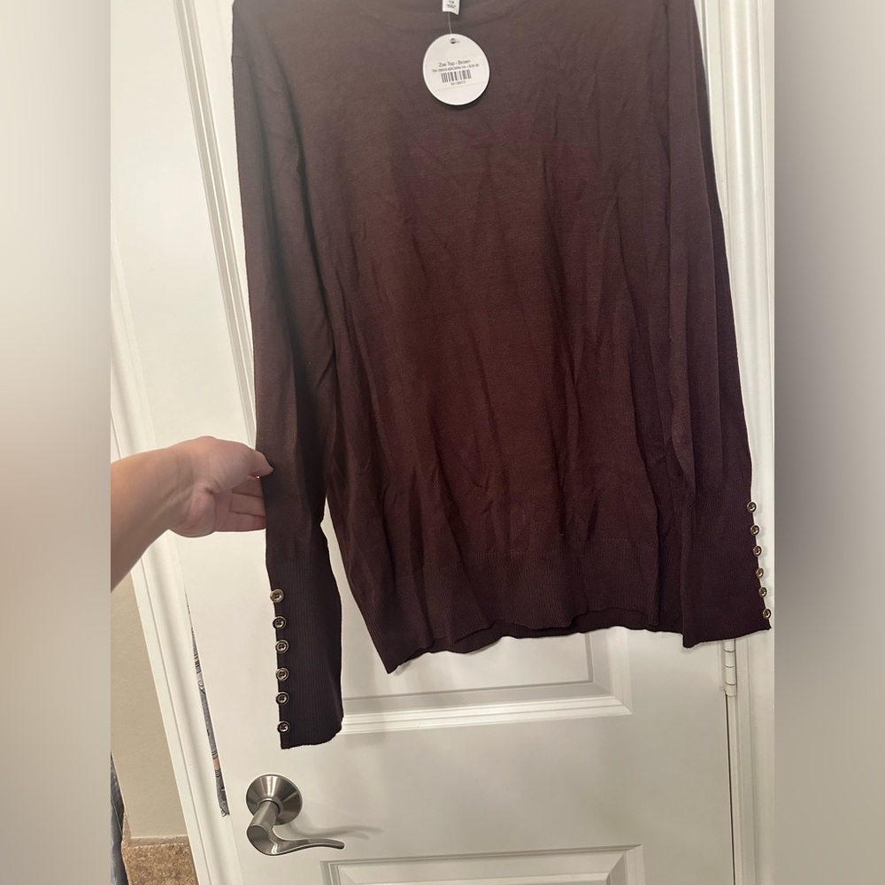 Zenana outfitters top with sleeve button details. Never worn.